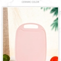 Pink oval plastic cutting board with non-slip texture and handle for fruit chopping - Pink