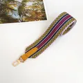Detail of yellow-green striped canvas bag strap with leather and gold metal hook - Gold Hook / Yellow Green with Yellow Trim