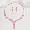 Detail of silver bridal necklace and pink marquise earrings on white silk fabric - 650 Pink