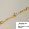 Close-up of 18k gold-plated stainless steel bead chain with 3mm spheres and 47cm length - 0.4 Cross Chain with 3cm Bead Spacing