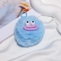 Detail of blue fuzzy monster keychain with purple lips on soft white fabric - Gate Buckle Style / Blue