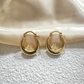 Close-up of golden U-shaped hollow earrings on champagne silk fabric background - 20mm / Gold
