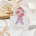 Floral greeting card featuring red carnations and a purple bow in a folded design - Happy Ending