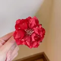 Elegant red mesh flower hair clip with multi-layered petals and white stamens - Red Camellia