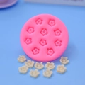 Close-up of pink silicone flower mold with small plum blossom cavities for cake decor - 11-Hole Plum Blossom Style(4)