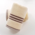 Light cream cotton towel with brown striped edges, soft terry fabric, folded set - Soft Intent Yellow Towel