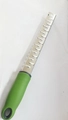 Multifunctional stainless steel cheese grater with an ergonomic green handle for baking - Cross Texture Green
