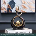 Modern abstract ceramic sculpture in black and gold finish, size 17x6x27cm for home decor - 17x6x27cm / Black Gold (Short)