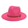 Detail of bright pink straw fedora hat featuring a brown leather strap and gold buckle - Rose Red