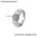Anello in acciaio al titanio argento con turchese e pietre ovali bianche su sfondo bianco - Anello Colore Acciaio-Misura 6