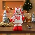 Close-up of a plush Christmas snowman doll with red knitted sweater and heart pattern - Snowman