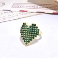 Gold pixel heart ring with green micro-zirconia stones shown on a vintage card background - Pixel Heart Style-Green Stone (ZYN-DMR120G-2)