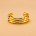 Macro detail of gold-plated titanium steel cuff bracelet featuring triple-row ribbed texture - Gold Three-Row Ridged Style (HZ47852BW0)