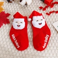 Detail of red Christmas baby socks with plush Santa decor and non-slip kiss baby print - S (0-1 Years Non-slip) / Smiling Santa