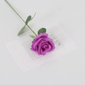 Artificial purple velvet rose with green leaves and stem on a white decorative card - Silk Deep Purple