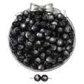 Detailed view of dark grey cat-eye beads for DIY jewelry making in a silver tray - Black