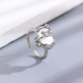 Silver-tone bow ring with white shell elements and zircon insets on textured band - Silver Shell Zirconia Open Ring (6169)