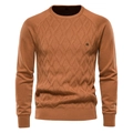 Detail of warm orange crew neck knit sweater showing fabric texture and size S collar tag - Caramel color
