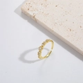 Minimalist adjustable gold open ring with small clear zircons on white stone base - White Zircon Style