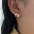 French style gold earring with micro-set heart zircon on model for elegant presentation - Heart Zirconia Earrings - Gold (EP5611)