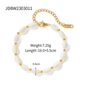 Macro detail of freshwater pearl and gold titanium steel bracelet with K18 tag - Gold Beaded Freshwater Pearl Bracelet (JDBW2303011)