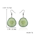 Handmade resin cucumber slice dangle earrings with size and weight dimensions shown - Cucumber