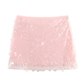 Detailed view of pale pink mini skirt featuring shimmering round sequin textures on fabric - XS / Light Pink