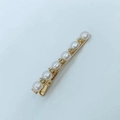 Elegant gold hair clip with six white pearls and sparkling rhinestones on blue background - 6 Pearls Rhinestone Hair Clip