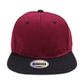 Close-up of a burgundy and black contrast snapback hat with a round holographic sticker - Black Brim Wine Red Hat