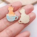 DIY orange kitten in a light blue coffee cup charm with Kittens in cups text - Blue Cup Orange Cat