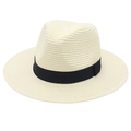 Detailed view of weave texture and black ribbon on a cream Panama straw hat - One Size / Cream