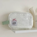 Détail de la pochette éléphant à pois vert menthe avec ruban rose et tissu matelassé - Sac Éléphant Vert Menthe