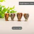 Set of four 2.5cm hand-carved natural agate angel figurines with unique earth-tone textures - Crazy Agate