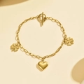 Bracelet coeur et trèfle en acier doré avec un fermoir à bascule OT design et sécurisé - Bracelet à Fermoir OT Cœur et Trèfle / Or