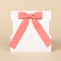 Pink corduroy bow hair clip with gold polka dots for girls, displayed on a card - Watermelon red