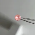 Sparkling pink faceted round gemstone held by tweezers for titanium screw-back earrings - 6mm Peach Pink (Single Piece)