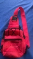Tactical red canvas chest bag with Molle system webbing and adjustable shoulder strap - Red