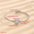 Silver stainless steel cable bangle with roman numerals and mother-of-pearl inlay - Cable Silver White Shell Roman Numeral