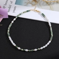 Detail of beaded necklace with white pearls, green stone cylinders and gold lobster clasp - Style 2