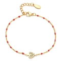 Close-up of a gold Tree of Life charm bracelet with red enamel beads and adjustable chain - Red