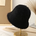 Women's black plush faux fur bucket hat displayed on a premium metal gold stand - Black