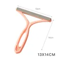 Pink manual pet hair remover tool with double-sided silicone brush and t-shaped design - Pink