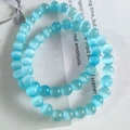 Blue 8mm cat eye stone beaded bracelet with glossy finish and cat eye effect - Sky Blue Cat Eye