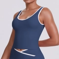 Close-up of navy blue yoga vest showing high-elastic fabric and white contrast piping detail - S / Navy Blue