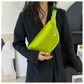 Detail showing neon translucent PVC chest bag with wide woven strap and zipper on model - Green