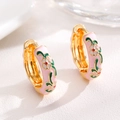 Detailed macro view of pink enamel flower hoop earrings with green leaf patterns - Pink (Zinc Alloy)
