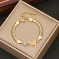 Böhmisches Gold-Edelstahlarmband mit mattem Schmetterling und blauer Perle im Vintage-Stil - Schmetterling