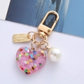 Pink heart resin keychain with silver glitter, white pearl and golden Follow your heart tag - Rose Red