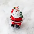 Classic 6.5cm Santa Claus figurine with red hand-painted resin finish for desk decor - Santa Holding Tree and Gift Box