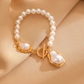 Detail of baroque pearl bracelet with gold metal OT clasp on beige textile background - Gold Baroque Pearl Round Bracelet (M-754)